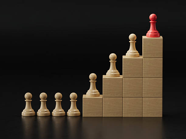 Red Pawn Tops Stepped Tower: Symbolizing Leadership and Ranked Success
