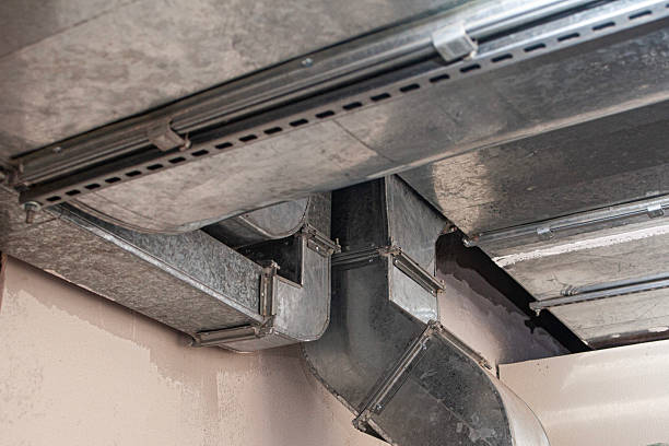 istock Industrial air ventilation ducts installed on a ceiling for HVAC system, showing airflow distribution and climate control. HVAC. Construction. Building infrastructure. 2251548575