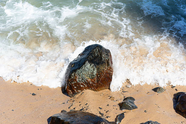 istock Sea Foam Covering the Sandy Beach 2251550119