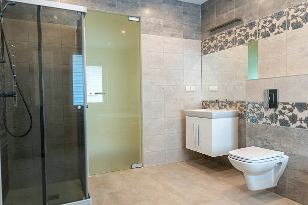 istock Modern Bathroom Interior with Shower, Washbasin, and Stylish Tiled Walls 2251552482