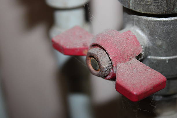 istock Valve with red handles covered in dust found in a maintenance area during a routine check at a building site in the morning 2251552671