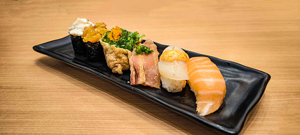 Sushi on a black plate Japanese food