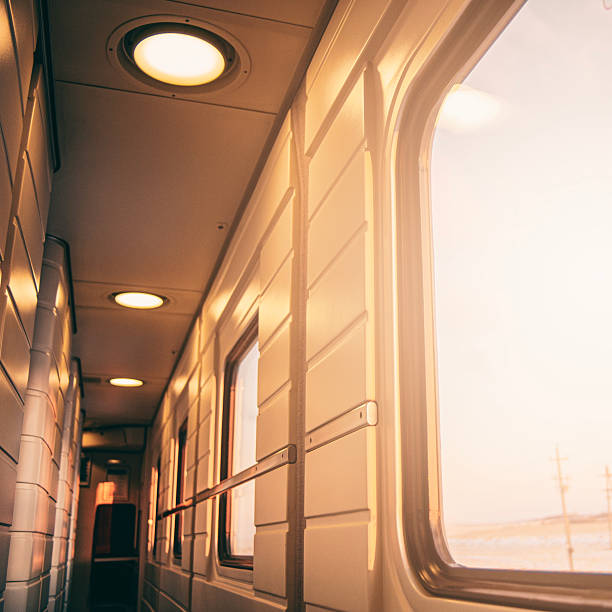 istock A view from inside a train car at sunset through the glass on a cold winter evening in a cozy train on a long journey 2251554773