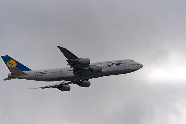 Lufthansa passenger airplane type Boeing 747-8 registration D-ABYI taking off from German Frankfurt Airport on a cloudy autumn day. Photo taken November 3rd, 2025, Frankfurt am Main, Germany.