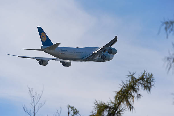 Lufthansa passenger airplane type Boeing 747-8 registration D-ABYD taking off from German Frankfurt Airport on a cloudy autumn day. Photo taken November 3rd, 2025, Frankfurt am Main, Germany.