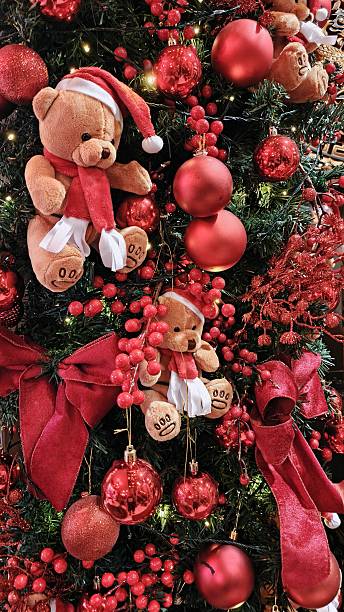 istock Cozy Christmas Tree with Teddy Bear Ornaments and Red Decorations 2251559301