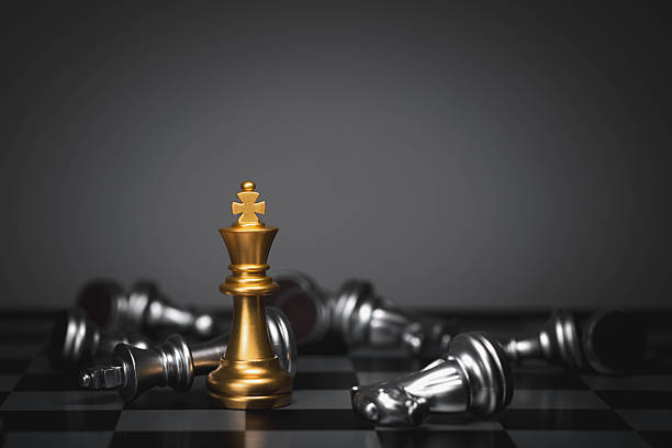istock A golden king chess piece standing among defeated silver pieces symbolizes leadership, strategy, victory, power, competitive success, and decisive decision-making in business and personal achievement. 2251559912