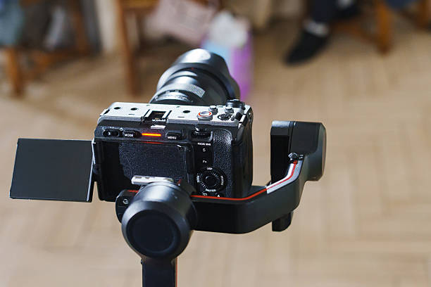 istock Camera on gimbal stand positioned for video recording in indoor setting 2251560437