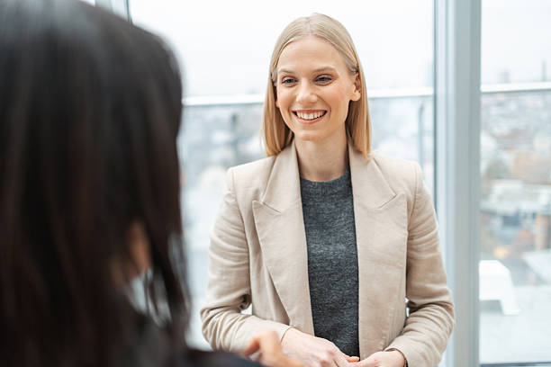 istock Happy businesswoman having conversation at modern office 2251561159