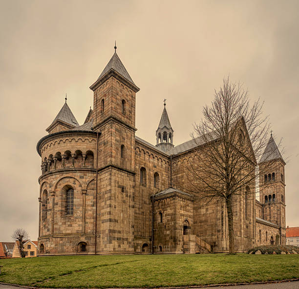 Viborg Cathedral with towers and round apse against a grey sky, Denmark, Viborg, December 5, 2025