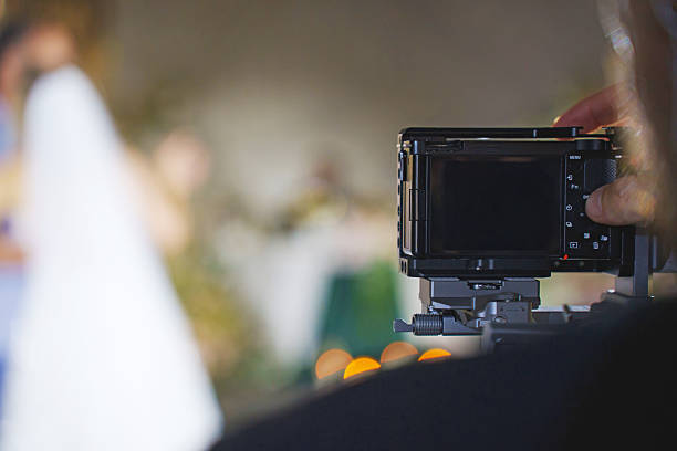 istock Photographer capturing a special moment during a wedding 2251561820