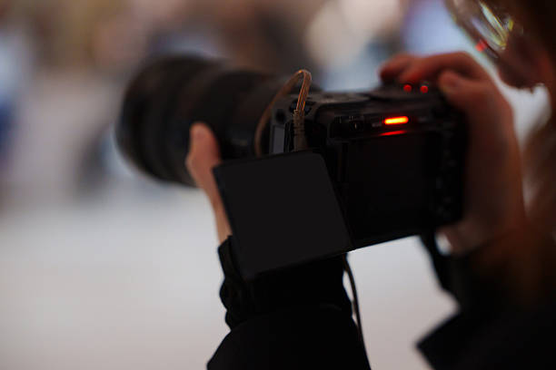 istock Capturing moments with a professional camera in action 2251565447