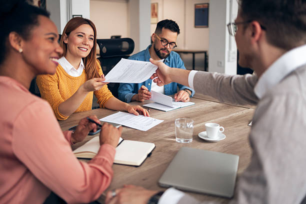istock Team Collaborating in Modern Office During a Business Meeting Discussion 2251568557