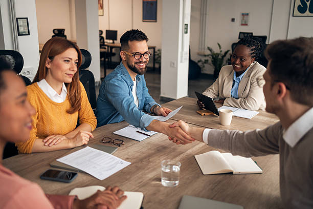 istock Smiling Business Team in a Collaborative Office Meeting 2251568634