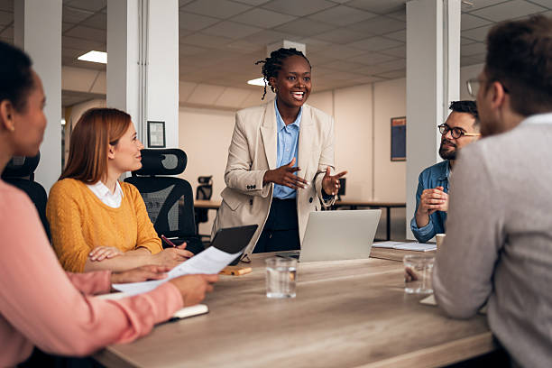 istock Businesswoman Leading a Team Discussion in a Modern Office Setting 2251568739