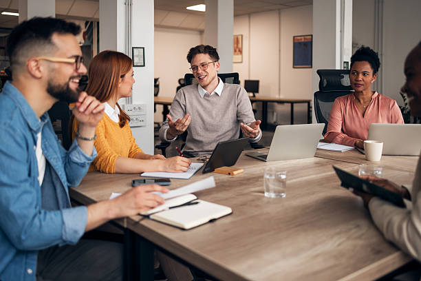 istock Group of Colleagues Discussing Ideas During a Collaborative Office Meeting 2251568771