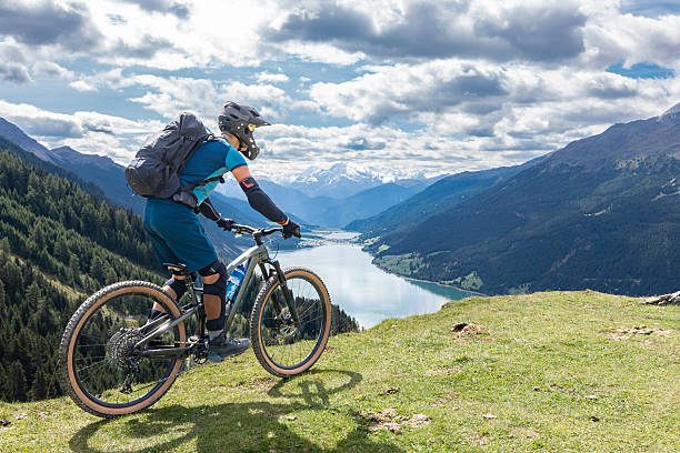istock Mountain biker overlooking Lake Reschen. 2251568826