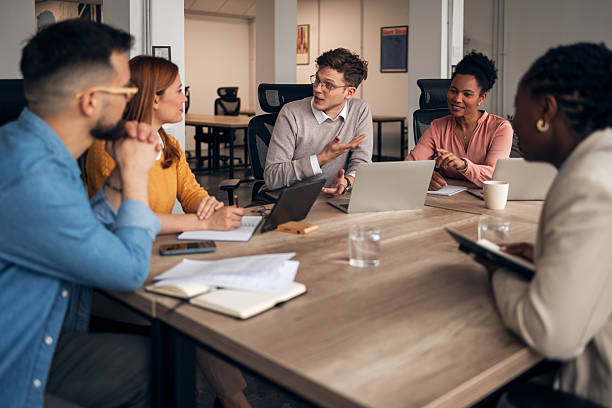 istock Diverse Team Meeting Discussing Ideas in a Modern Office Setting 2251568828