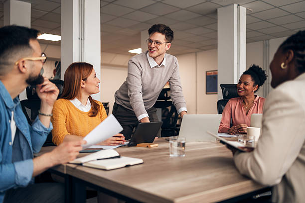 istock Professionals Collaborating During a Business Meeting in a Bright Office Setting 2251568849