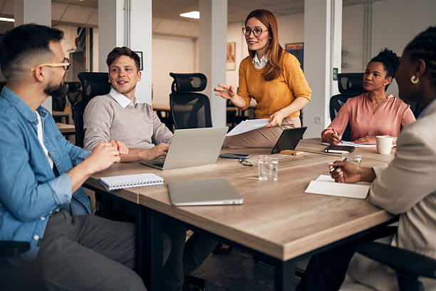 istock Team Discussing Project Plans Around a Workplace Meeting Table 2251568945