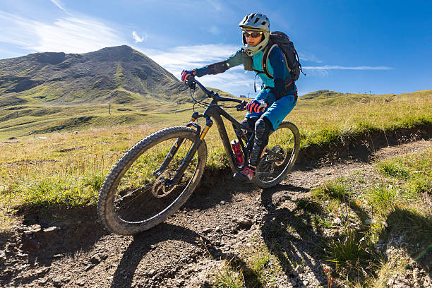 istock Female mountain biker in speedy turn. 2251569257