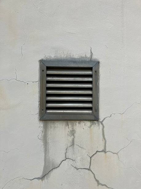 istock ventilation grille damaged wall moisture stain inspection 2251569381