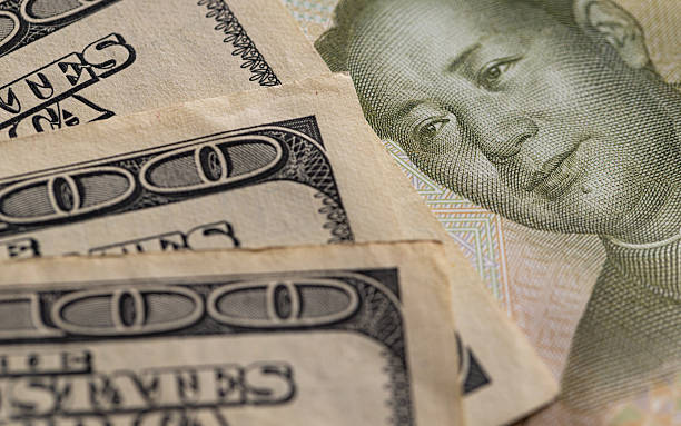 istock Dollar Yuan Close-up Trade War Conflict Concept 2251569581