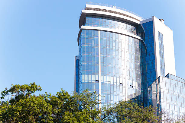 istock modern glass exterior facade skyscraper architectural object for offices working places green city scape clear weather view day 2251570326
