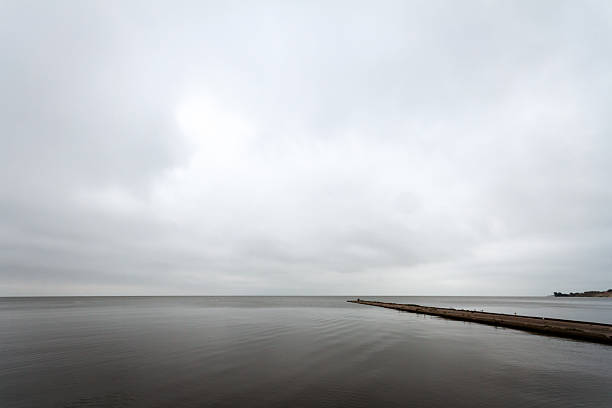 Old concrete pier under a cloudy sky in Nida, Curonian Spit and Curonian Lagoon, Lithuania