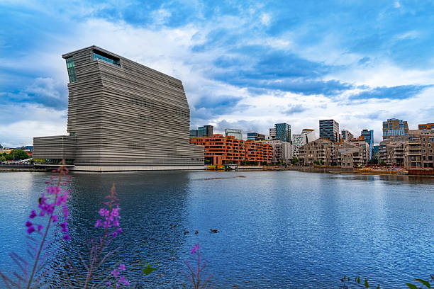 Oslo, Bjorvika waterfront skyline in summer sunny day showing modern architecture and calm harbor waters