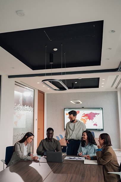 istock Diverse business team collaborating during meeting in modern office 2251584321