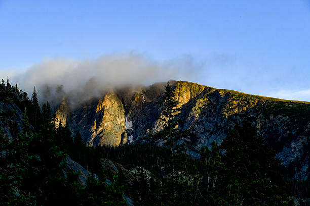 The mountain stands unveiled — raw, clean, and eternal. Mist withdraws like a curtain, revealing snow-veined peaks in the soft glow of late-day sun. The air is clear, and every ridge carries the weight of silence earned through chaos. It’s the aftermath of struggle, the moment when the mountain exhales and peace descends. The frame captures the simplicity of grace — a balance between endurance and serenity, between storm’s memory and light’s return.