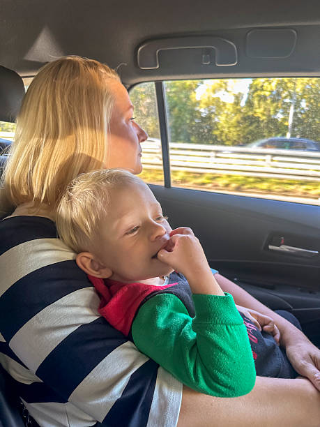 istock Caucasian Mother Comforting Young Son During Car Ride 2251587541