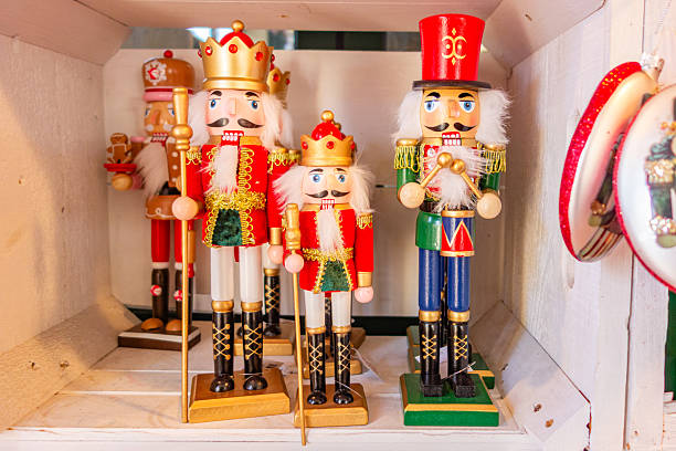 Christmas, nutcracker, holiday decor, wooden figurines, festive season, traditional craft, colorful, handmade, toy soldier, Christmas market, holiday cheer, winter decorations, handcrafted ornaments, classic decor, nostalgic, Christmas toys, home decor, festive spirit, yuletide, seasonal celebration, cultural tradition, winter holidays, red and green, festive display, holiday collection, wooden toys, holiday nostalgia, celebration, handcrafted details, German tradition, festive craftsmanship, Christmas display, festive culture, Christmas decorations, family tradition, holiday spirit, decorative objects, vibrant colors, collectible figurines, cheerful atmosphere