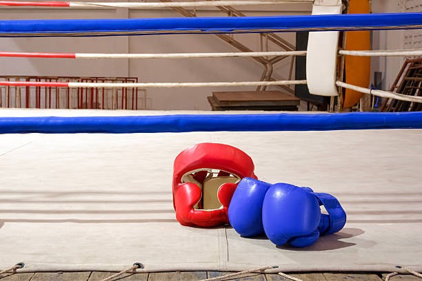 Algorta, Bizkaia, Spain, August 9, 2024, boxing gloves hanging on the ring ropes prepared for an outdoor evening