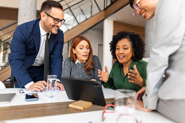 istock Happy Business Team Collaborating on a Project in Modern Office 2251596501