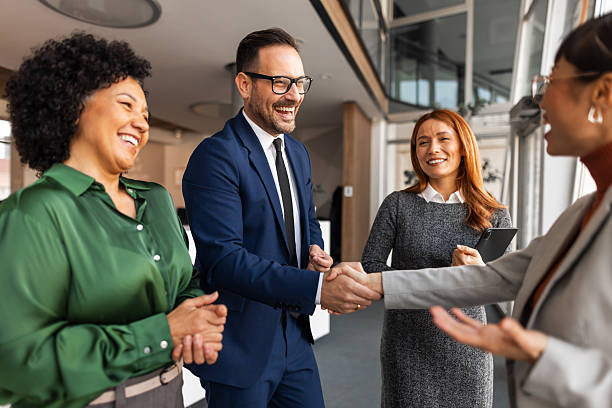 istock Business Professionals Engaging in a Productive Handshake and Conversation 2251597143