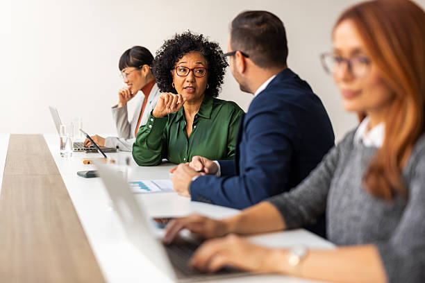 istock Professional Team Collaborating During an Office Meeting with Laptops and Documents 2251597701