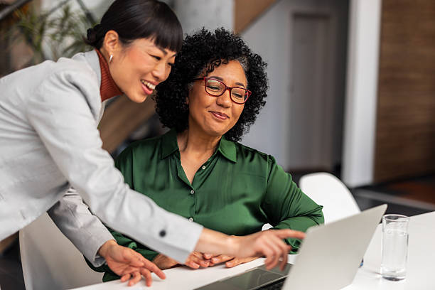 istock Two Women Collaborating on a Laptop in an Office Environment 2251598769