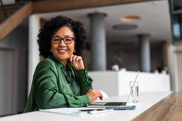 istock Professional Woman Smiling Confidently in a Modern Office Setting 2251598794