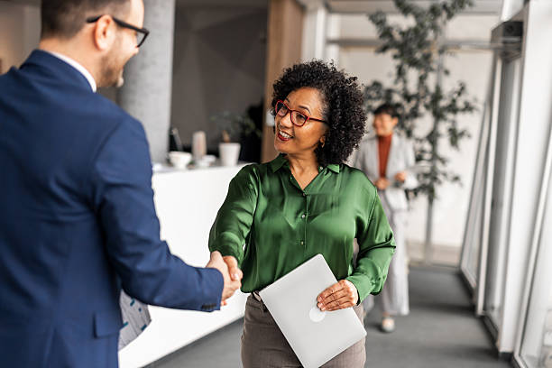 istock Professional Handshake During Business Meeting in Modern Corporate Office 2251600001