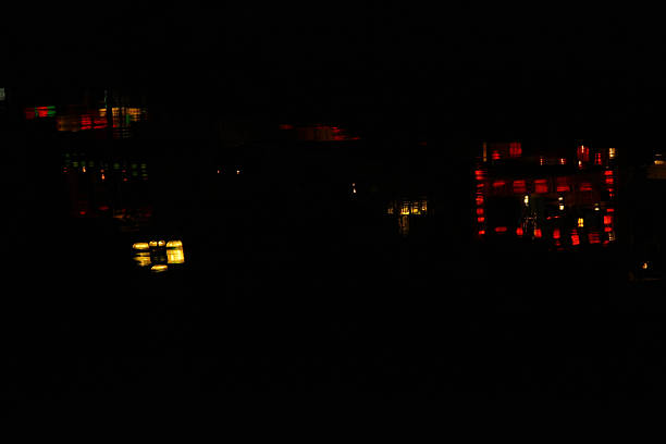 MS glowing silk lanterns reflected in water in Hoi An, Vietnam