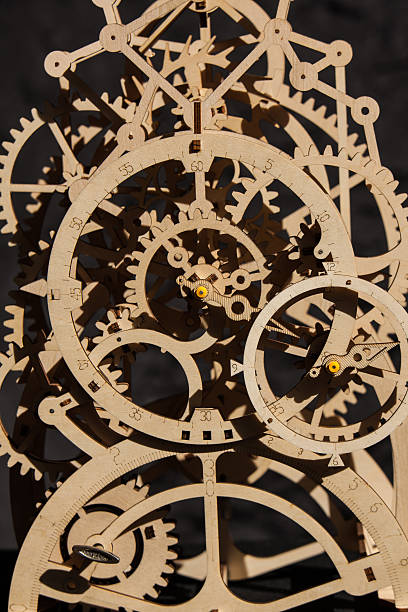 istock Intricate Wooden Mechanical Clock Model with Interlocking Gears 2251601123