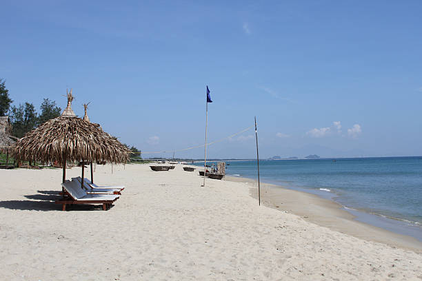 View of Bai Xep beach in Phu Yen province, Vietnam. Tropical coast from cliff above. Vietnam travel destination, golden sand beach waving sea rock boulders. Travel and landscape concept