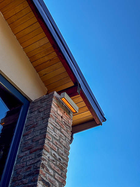 istock Modern Outdoor Wall Light on Brick Column Against Blue Sky 2251602082