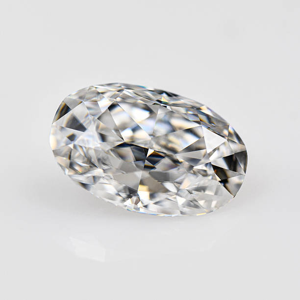 istock A white oval cut diamond is sitting on a white surface 2251603381