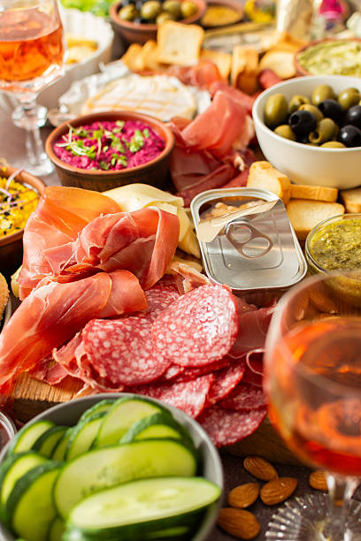 istock This festive spread features an array of cheese, cured meats, hummus, nuts, and fresh vegetables. Perfect for sharing at a casual get-together or celebration with friends 2251608687