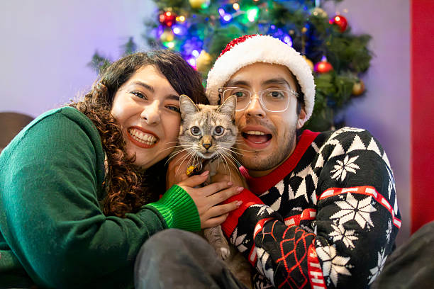 istock Happy couple at Christmas with their cat 2251610835