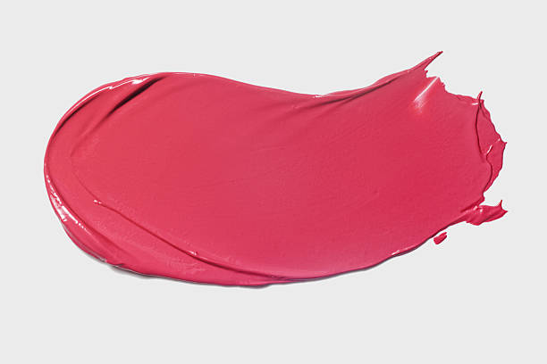 istock Beauty makeup product sample swatch. Glossy neon pink liquid lip 2251612012