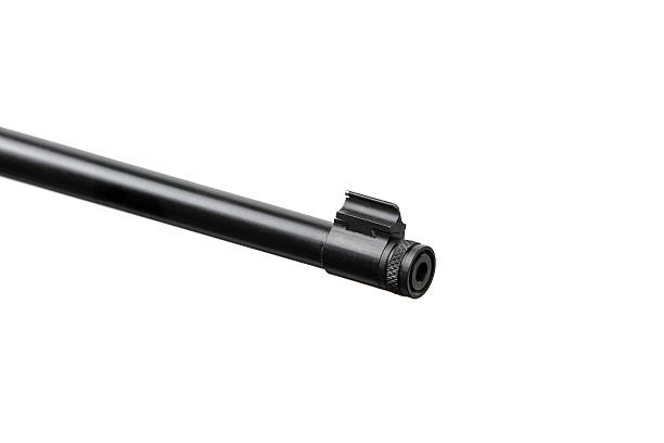 istock Muzzle of a black rifle barrel with a front sight and threaded end, isolated on white. 2251612821
